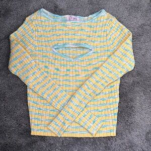 Blue and Yellow Vrg Grl knit top with cut out in chest.